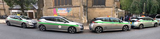A line of Cambridge's electric taxis