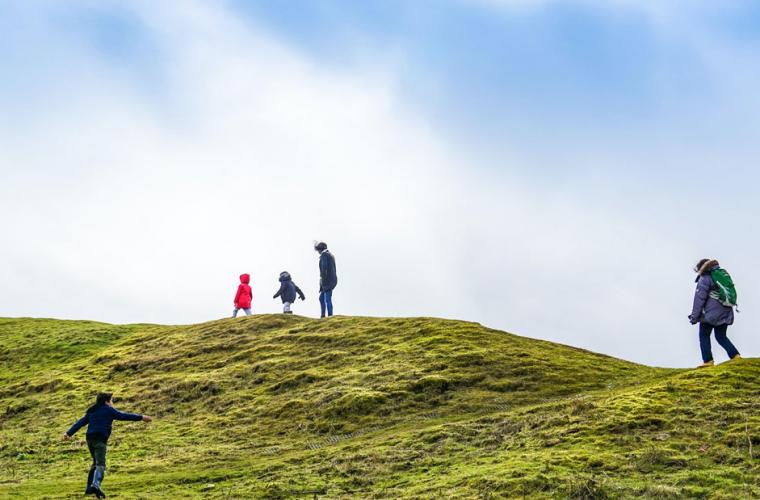 Family walking on a hill 941 x 641px