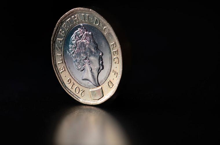 A pound coin on a table