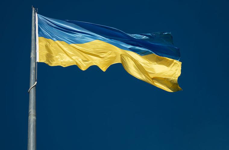 Ukrainian blue and yellow flag against a blue sky