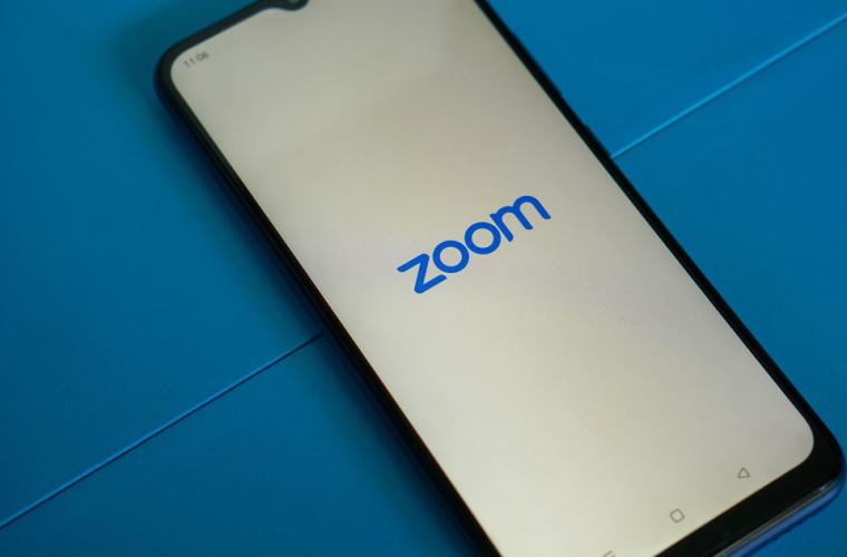Smartphone with the screen showing the Zoom logo