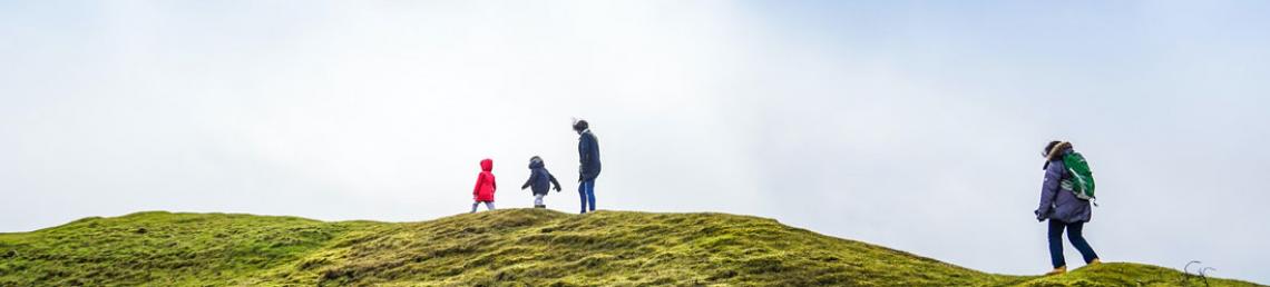 Family walking on a hill 