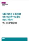 A light blue background with an image of fanned out documents with text in blue reading Shining a light on early years nutrition: The role of councils