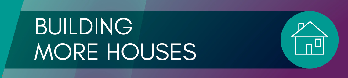 Dark green banner with the text building more houses