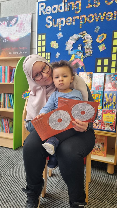 Amine with his mum at Parr library Read and Rhyme time session