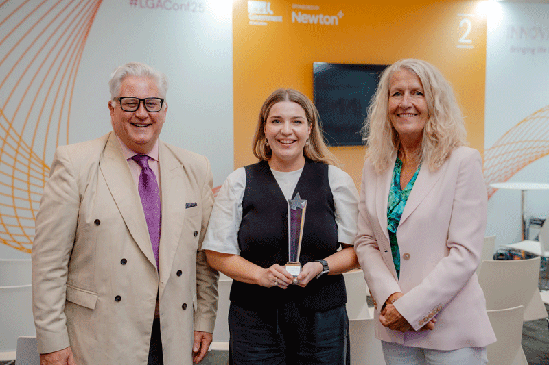 LG Challenge 2025 winner Harriet Vitty (centre), with Cllr Kevin Bently and Cllr Louise Gittens. copyright: LGA/Joe Outterside’