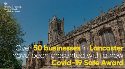 Lancaster cathedral in the background with the text: Over 50 businesses in Lancaster have been presented with a new Covid-19 safe award  