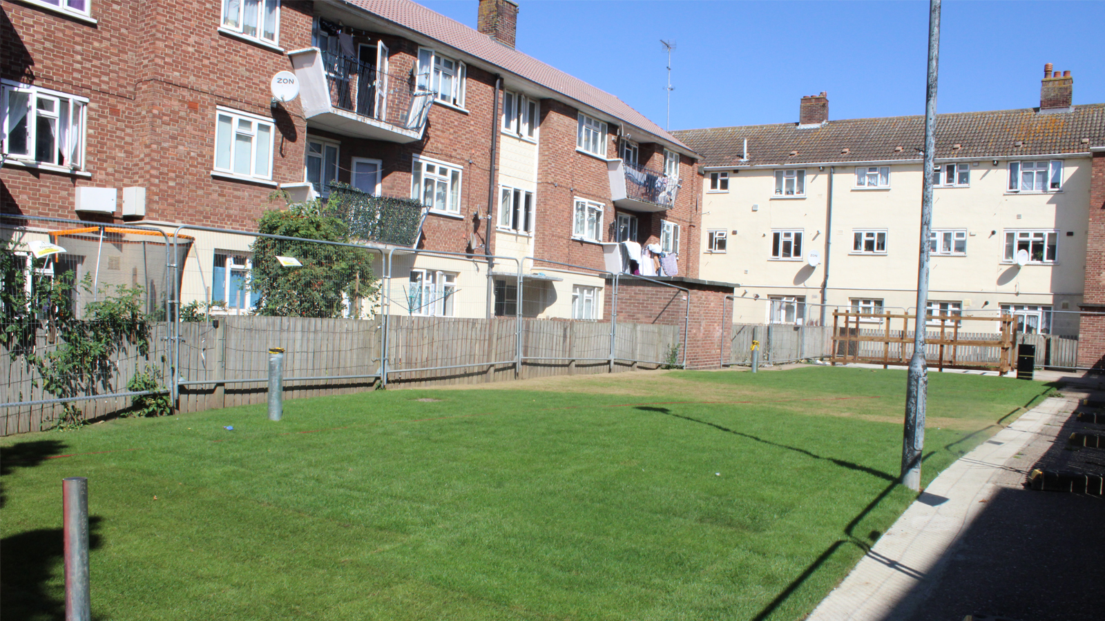 Partially finished new play areas surrounded by housing estate