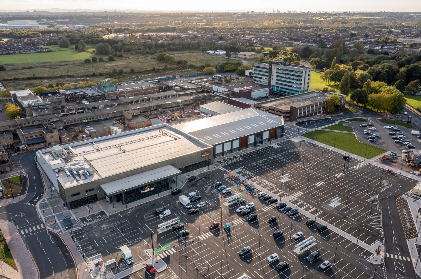 Aerial view of a large detached Morrisons superstore with a car park in front