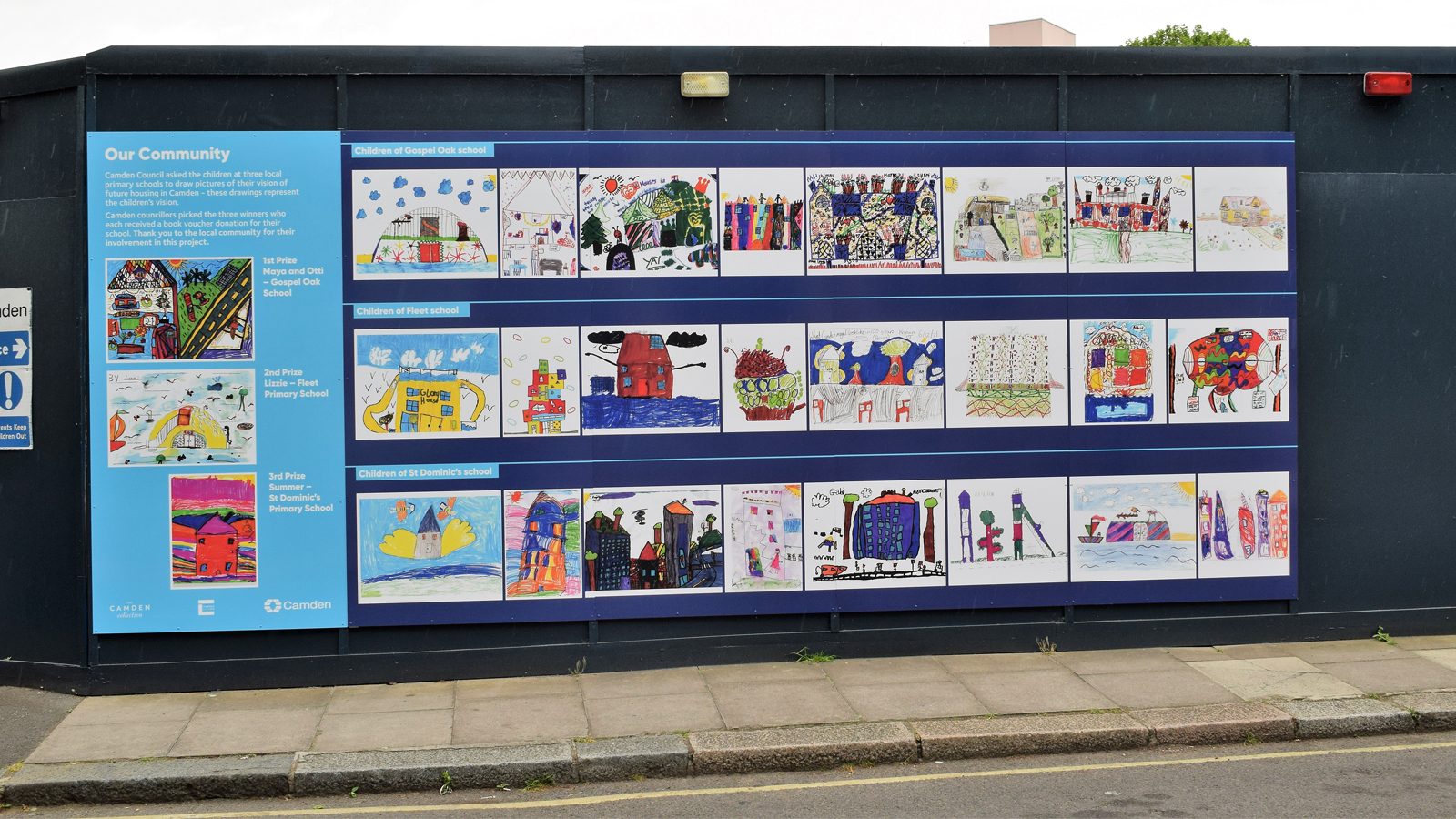 Drawings by Camden school children that illustrate their visions of the future of housing in the borough, which are being displayed on the hoarding of a building site