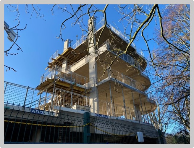 Photo of housing units going up, mid-construction
