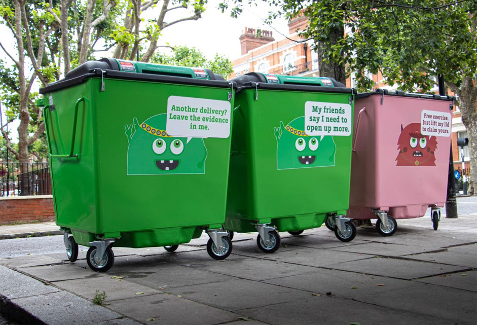 Three bins with cartoon monster designs