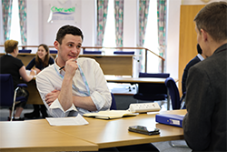 Team Captain Joe listening intently in the council room