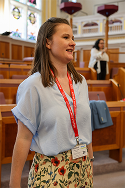 Team Captain Zoe speaking to someone in Wigan council chambers