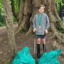 Young boy volunteer litter picking