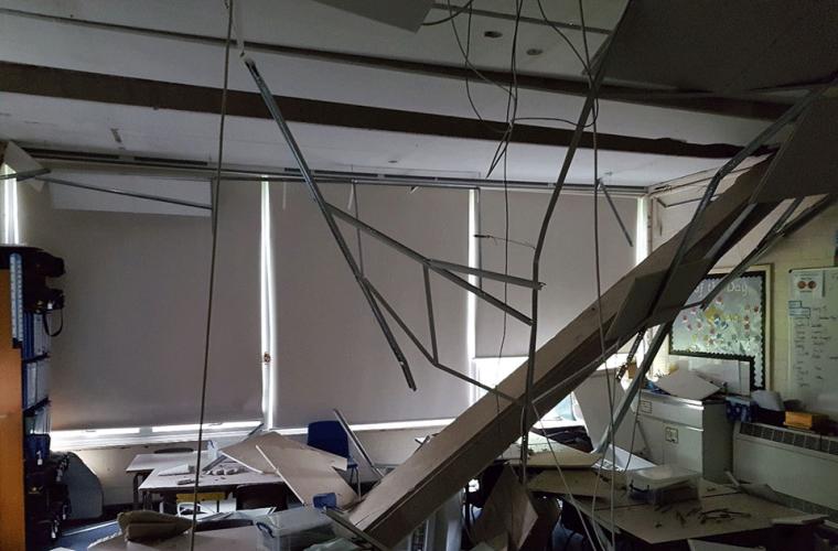 Damaged interior of school building with collapsed roof