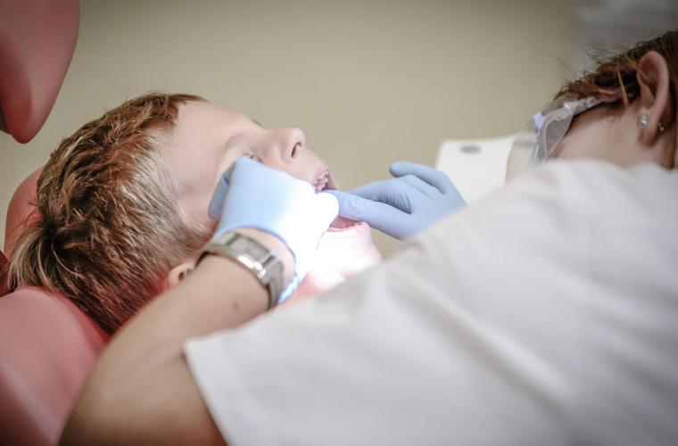 A child having a tooth removed