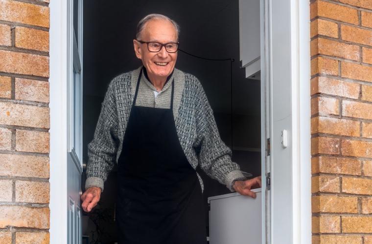 Elderly man at his front door