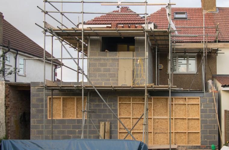 House under construction with scaffolding