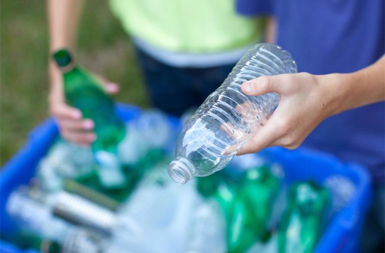 Photo of green and clear empty plastic bottles