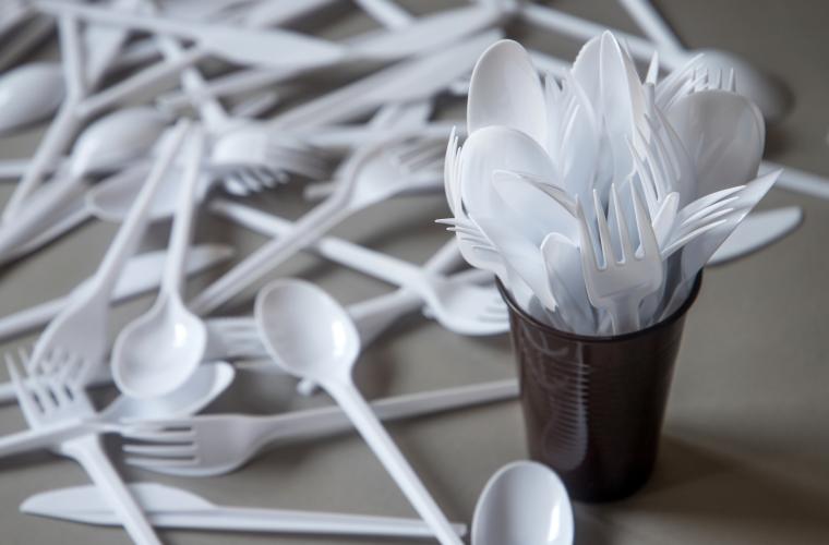 A pile of plastic cutlery