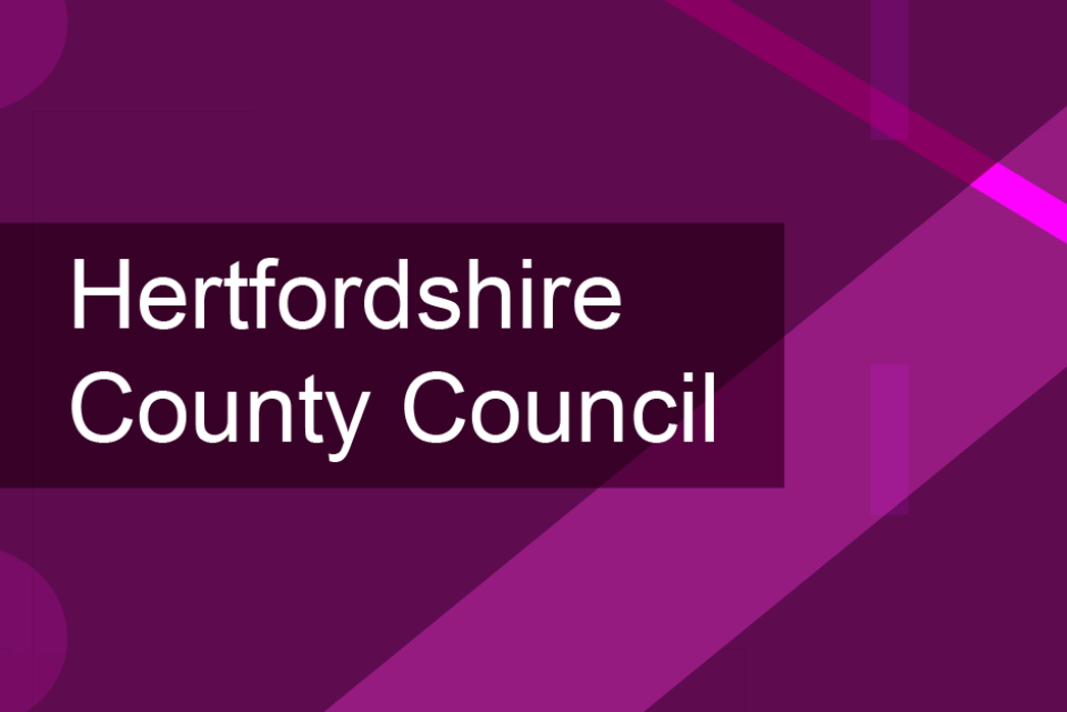 Purple background with two lighter purple diagonal lines with the text Hertfordshire County Council on