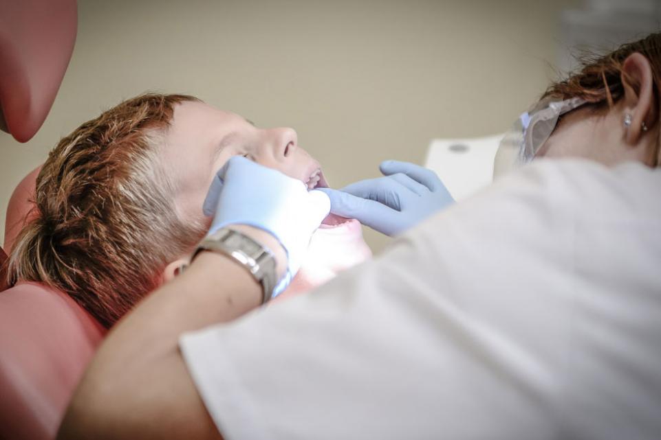 A child having a tooth removed