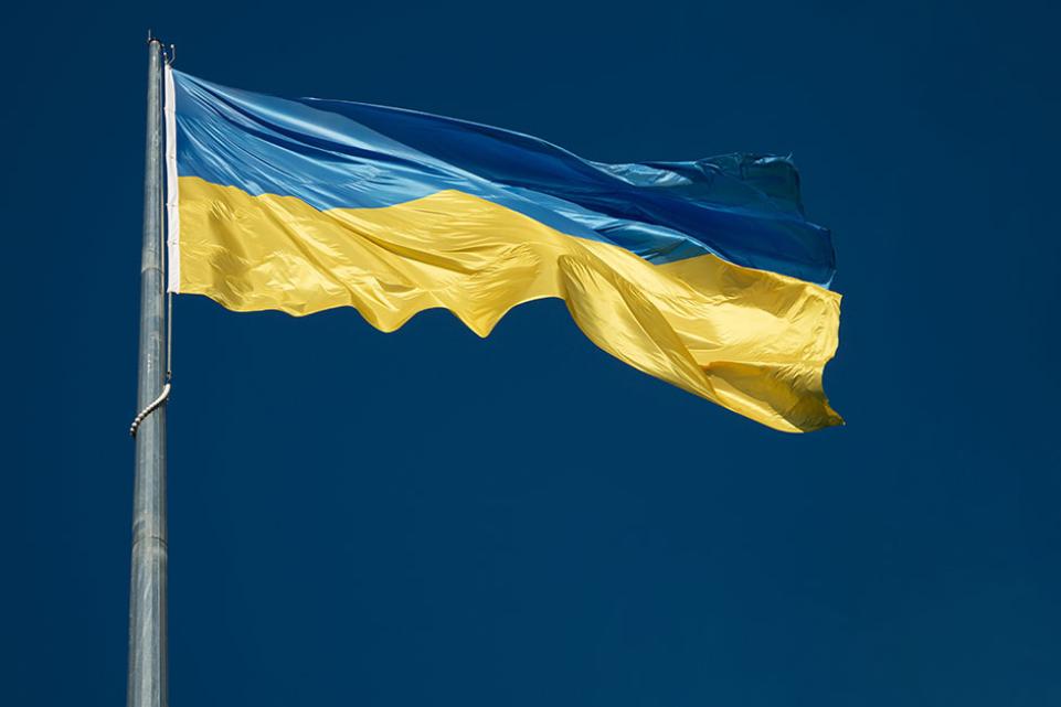 Ukrainian blue and yellow flag against a blue sky