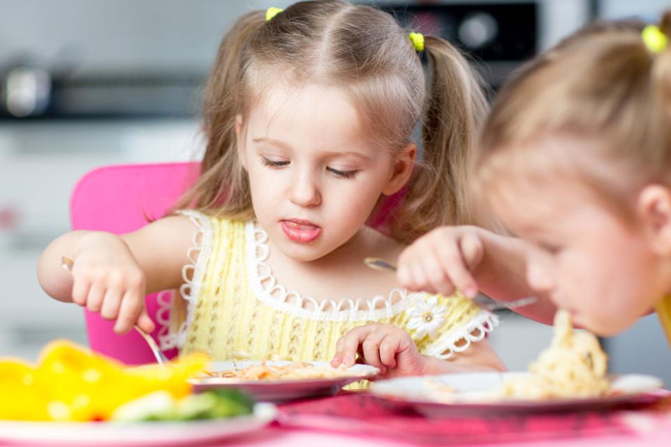 Photo of toddlers eating
